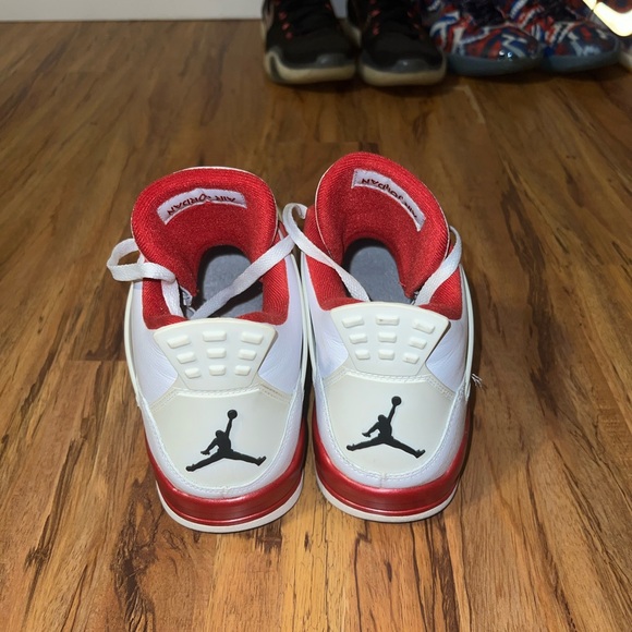 Air Jordan 4 White and Red Sneakers - Picture 3 of 5